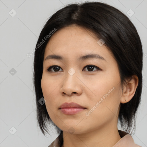 Joyful asian young-adult female with medium  black hair and brown eyes