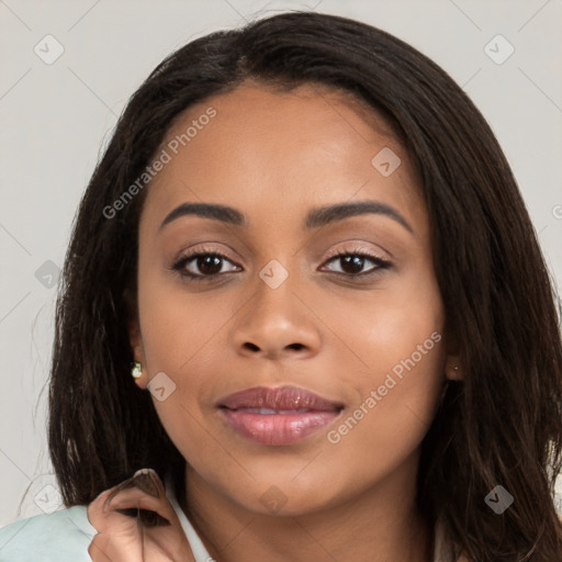 Joyful latino young-adult female with long  brown hair and brown eyes