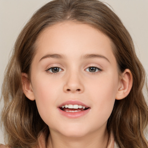 Joyful white child female with long  brown hair and brown eyes