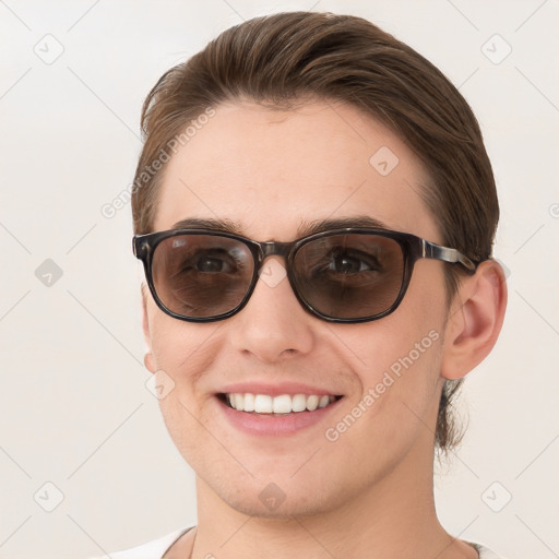 Joyful white young-adult female with short  brown hair and brown eyes