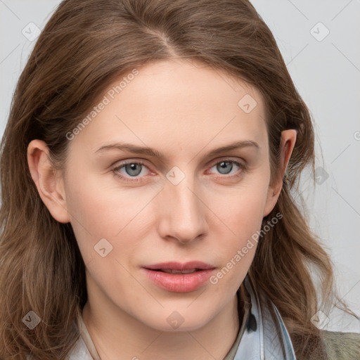 Joyful white young-adult female with long  brown hair and blue eyes