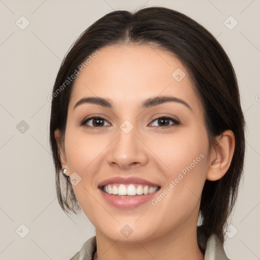 Joyful white young-adult female with medium  brown hair and brown eyes