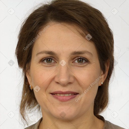 Joyful white adult female with medium  brown hair and brown eyes