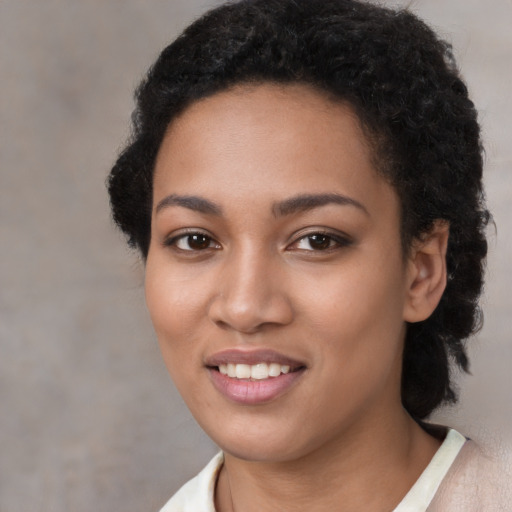 Joyful latino young-adult female with short  black hair and brown eyes