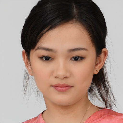 Joyful asian young-adult female with medium  brown hair and brown eyes