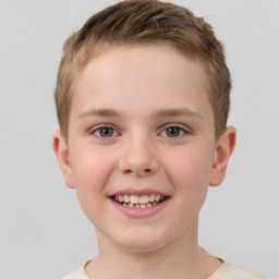 Joyful white child male with short  brown hair and brown eyes