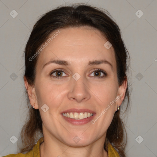 Joyful white adult female with medium  brown hair and brown eyes