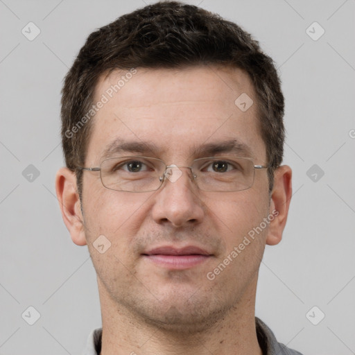 Joyful white adult male with short  brown hair and grey eyes