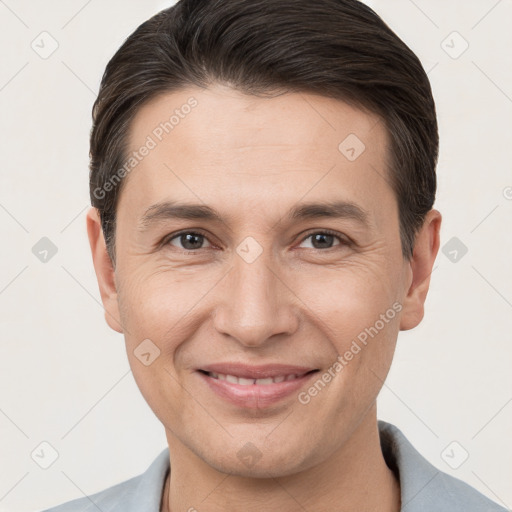 Joyful white adult male with short  brown hair and brown eyes