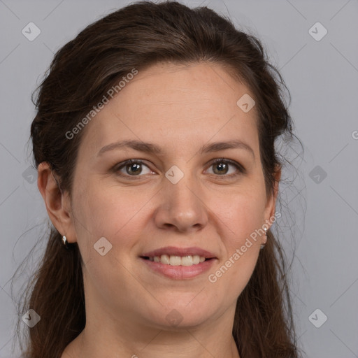 Joyful white young-adult female with long  brown hair and grey eyes