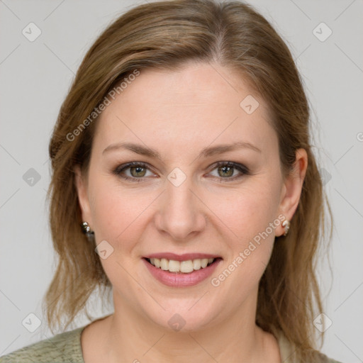 Joyful white young-adult female with medium  brown hair and green eyes