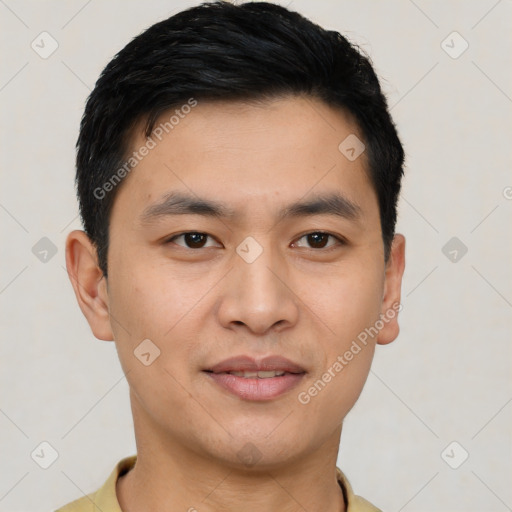 Joyful asian young-adult male with short  black hair and brown eyes