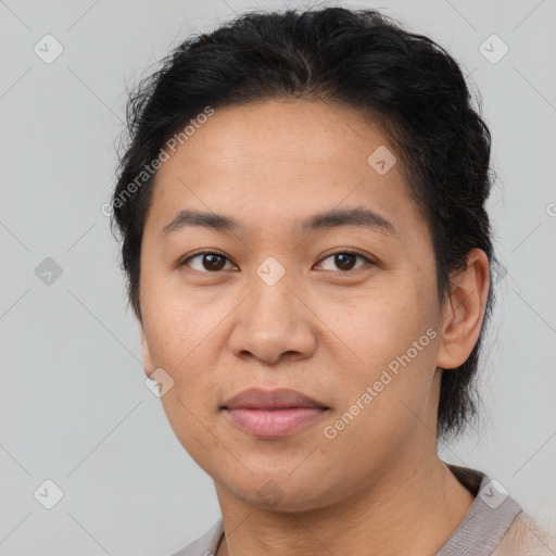 Joyful latino young-adult female with short  brown hair and brown eyes