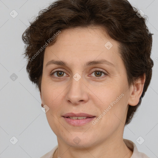 Joyful white adult female with short  brown hair and brown eyes