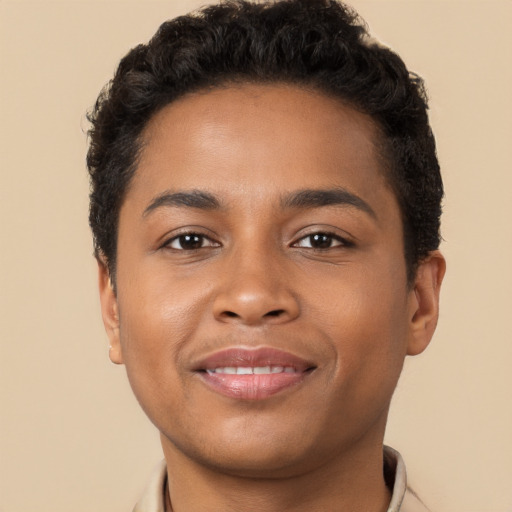 Joyful latino young-adult male with short  brown hair and brown eyes