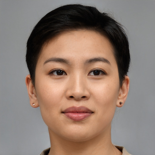 Joyful asian young-adult female with short  brown hair and brown eyes