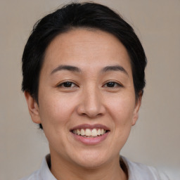 Joyful white young-adult female with medium  brown hair and brown eyes