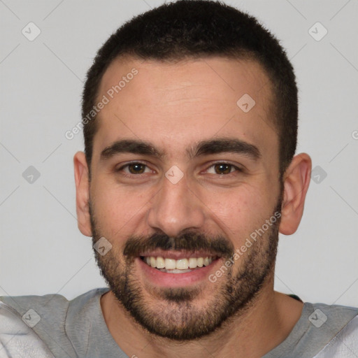 Joyful white young-adult male with short  brown hair and brown eyes