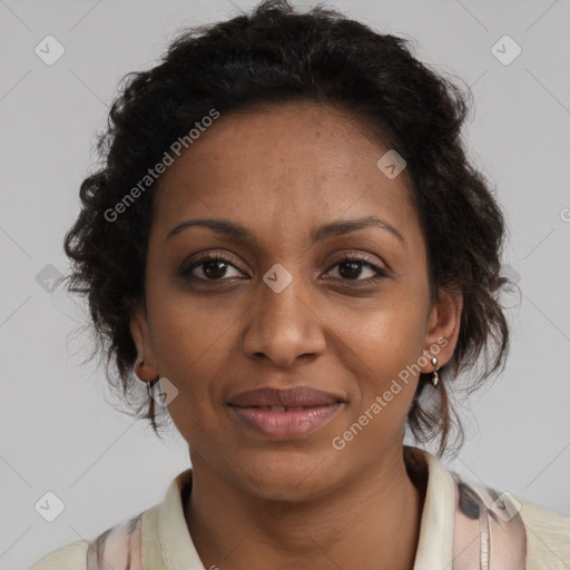 Joyful black adult female with medium  brown hair and brown eyes