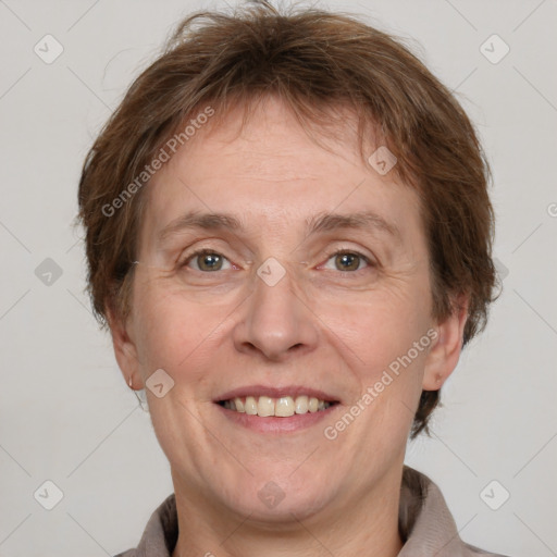 Joyful white adult male with short  brown hair and grey eyes