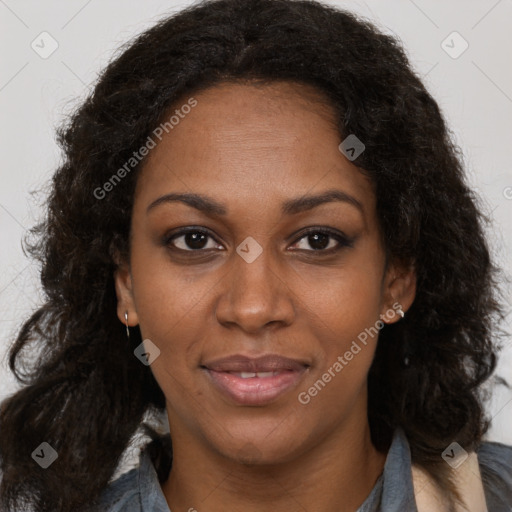 Joyful black adult female with long  brown hair and brown eyes