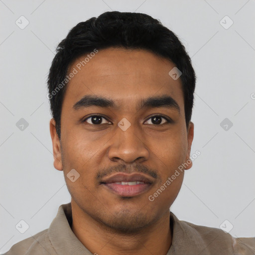 Joyful latino young-adult male with short  black hair and brown eyes