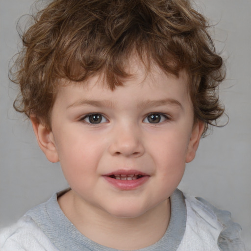 Joyful white child male with short  brown hair and brown eyes