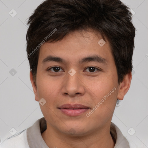 Joyful asian young-adult male with short  brown hair and brown eyes