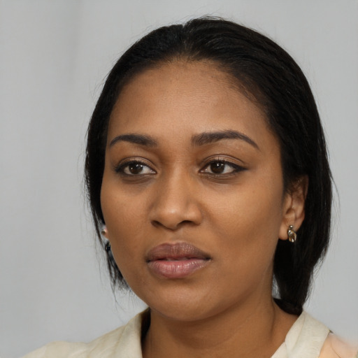 Joyful black young-adult female with medium  black hair and brown eyes