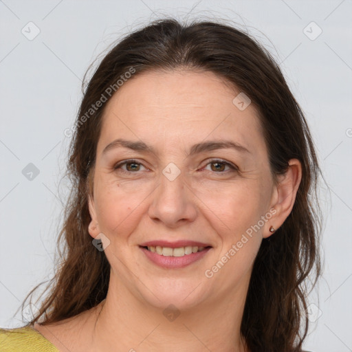 Joyful white adult female with medium  brown hair and brown eyes