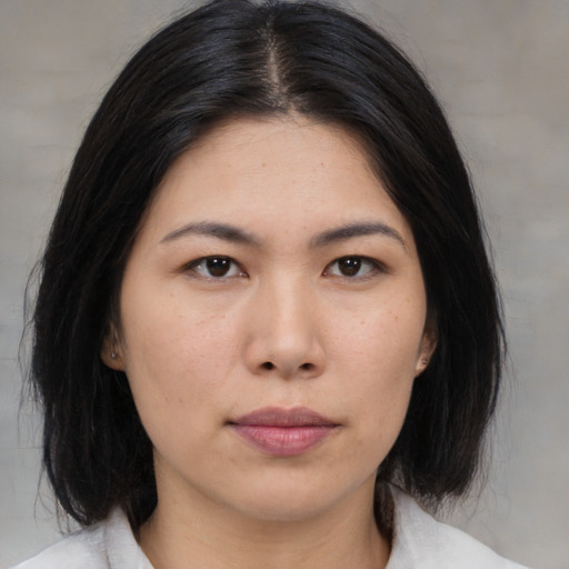 Neutral asian young-adult female with medium  brown hair and brown eyes