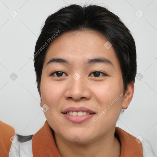 Joyful asian young-adult female with short  black hair and brown eyes