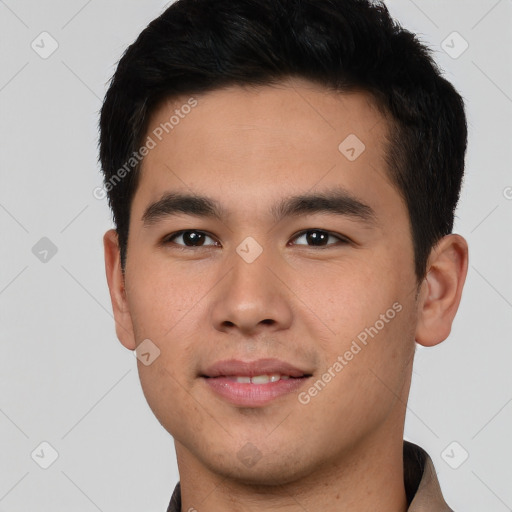 Joyful asian young-adult male with short  black hair and brown eyes