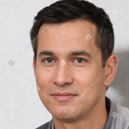 Joyful white adult male with short  brown hair and brown eyes