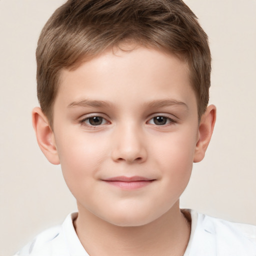 Joyful white child male with short  brown hair and brown eyes