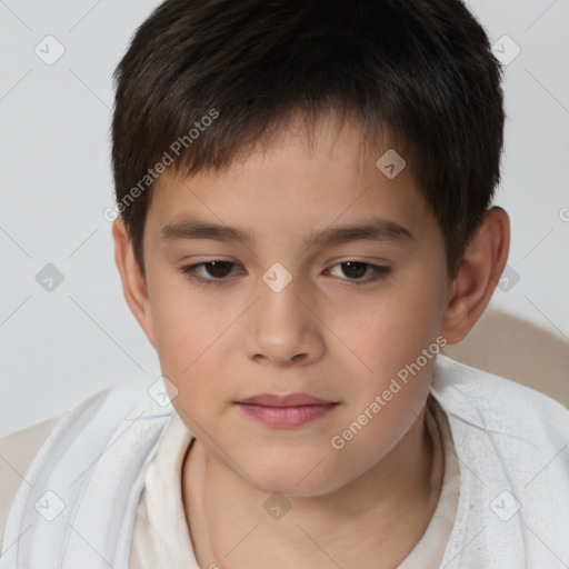 Joyful white child male with short  brown hair and brown eyes