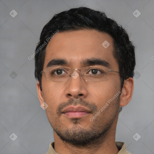 Neutral latino young-adult male with short  black hair and brown eyes
