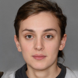 Neutral white young-adult female with short  brown hair and brown eyes