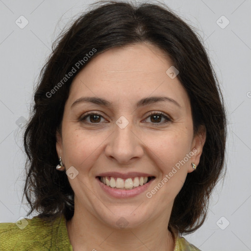 Joyful white adult female with medium  brown hair and brown eyes