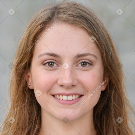 Joyful white young-adult female with long  brown hair and green eyes