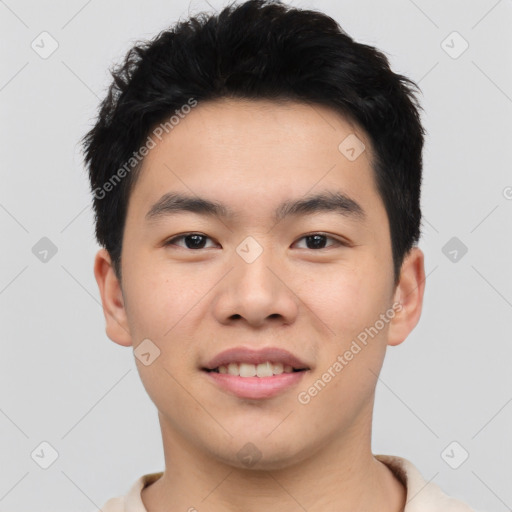 Joyful asian young-adult male with short  black hair and brown eyes