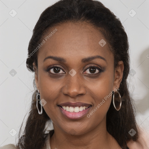 Joyful black young-adult female with long  brown hair and brown eyes