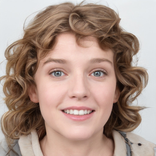 Joyful white child female with medium  brown hair and blue eyes