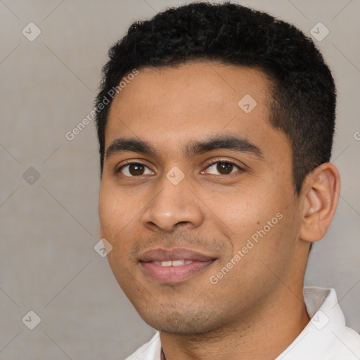 Joyful latino young-adult male with short  black hair and brown eyes