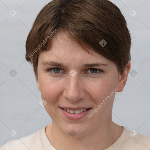 Joyful white young-adult female with short  brown hair and grey eyes