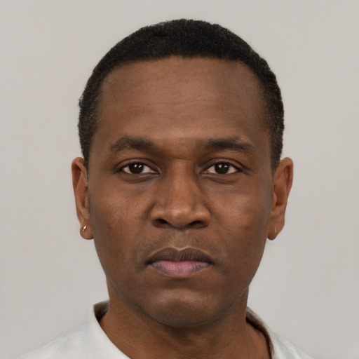 Neutral black young-adult male with short  black hair and brown eyes
