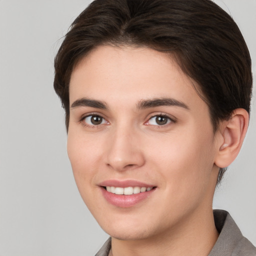 Joyful white young-adult female with short  brown hair and brown eyes