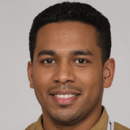 Joyful latino young-adult male with short  brown hair and brown eyes