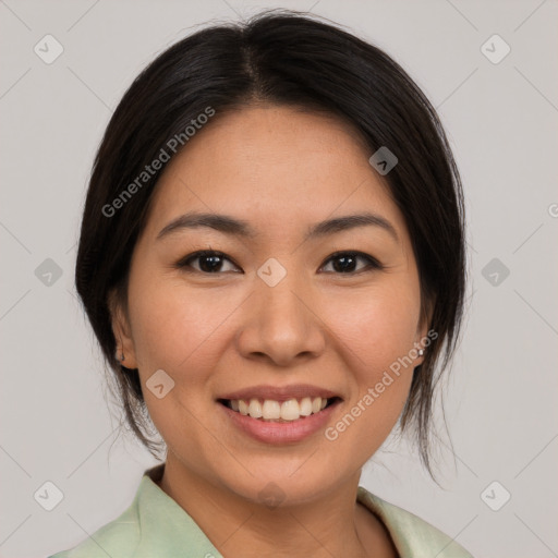 Joyful asian young-adult female with medium  black hair and brown eyes