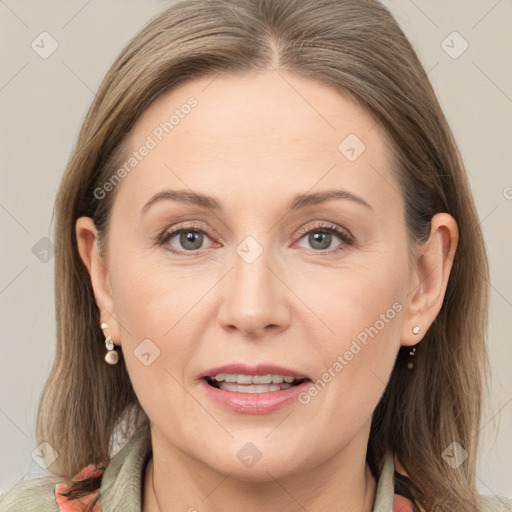 Joyful white adult female with medium  brown hair and grey eyes